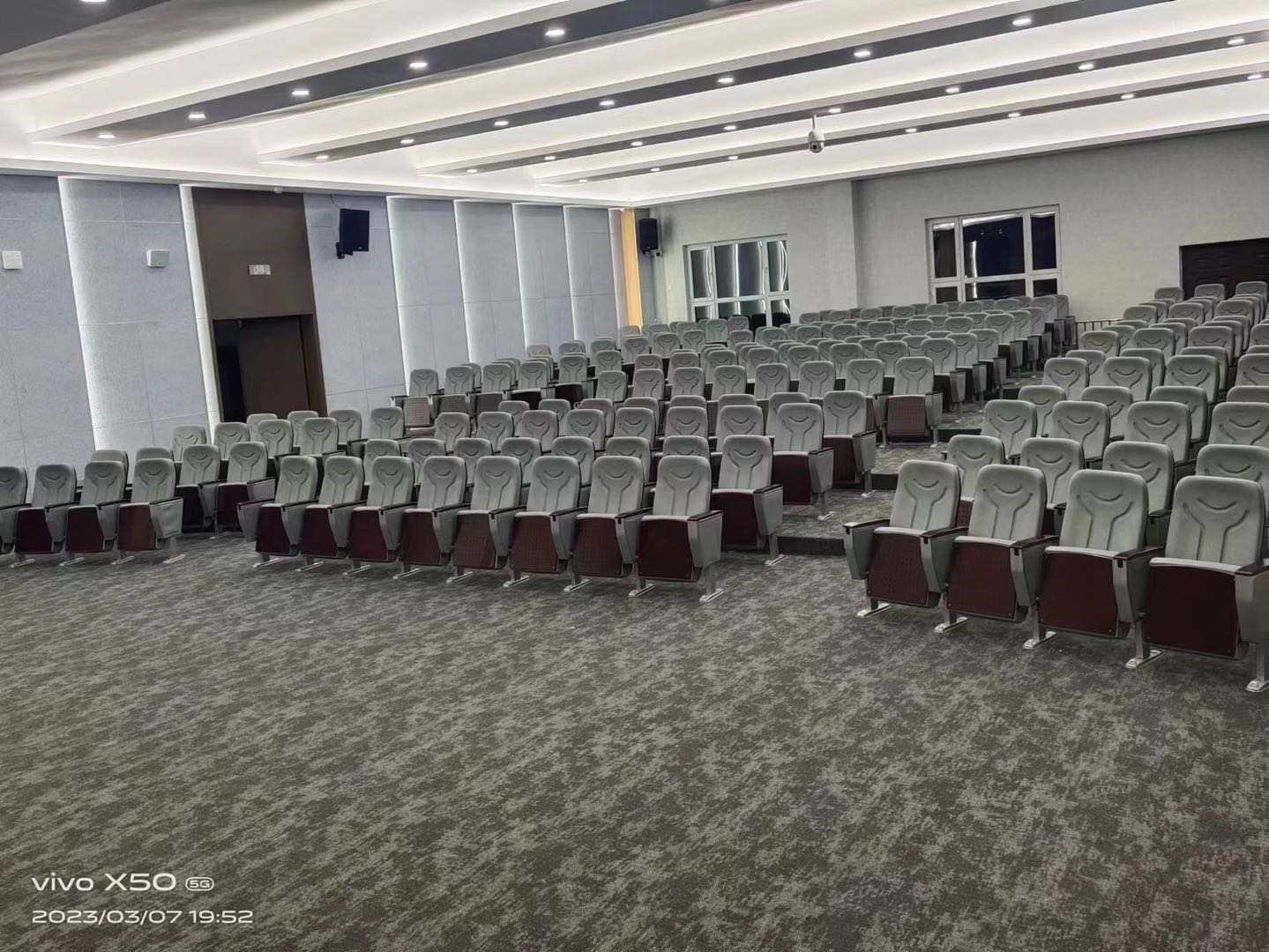 Completed gray auditorium seating installation
